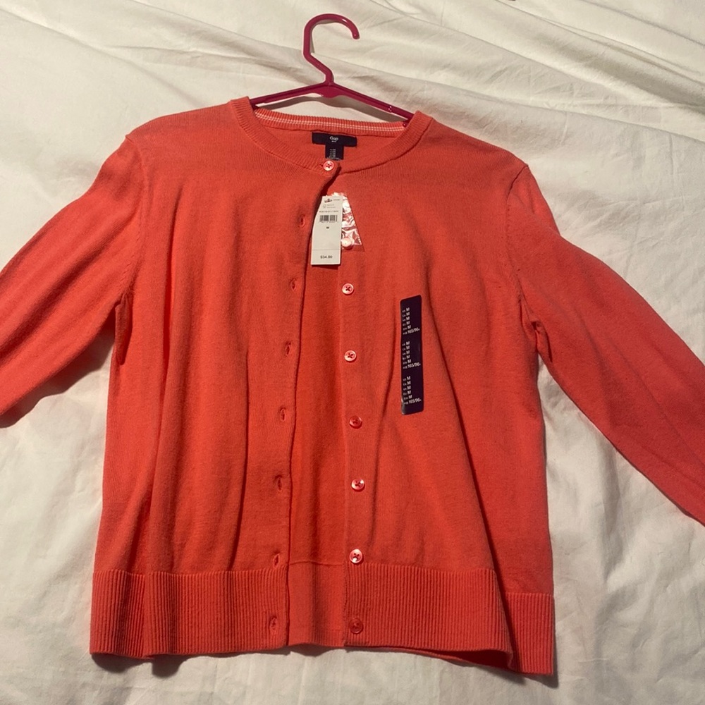New with tags peach GAP cardigan. Button up. Cuffed sleeve